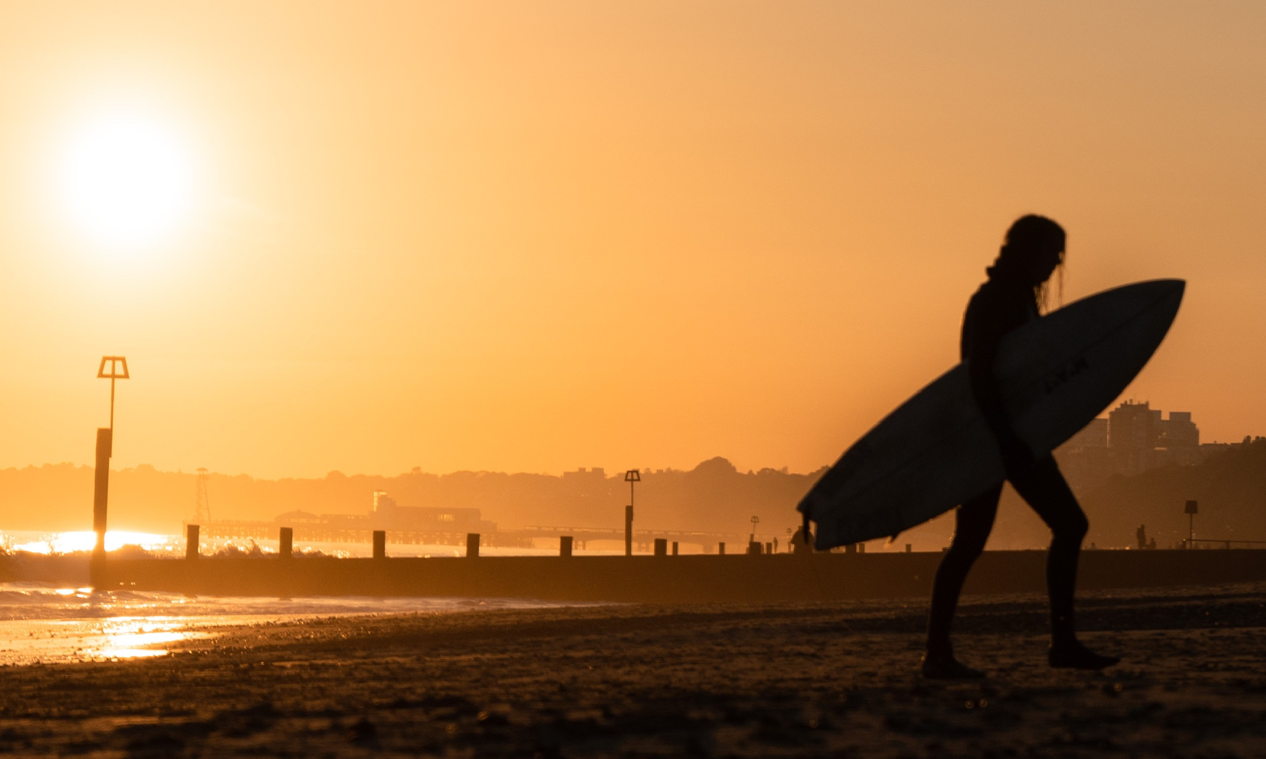 Surfing at sunset at Boscombe.